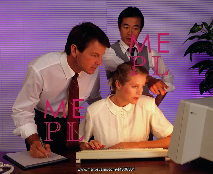 : 1990s business people working together at computer : 1990s business people working together at computer