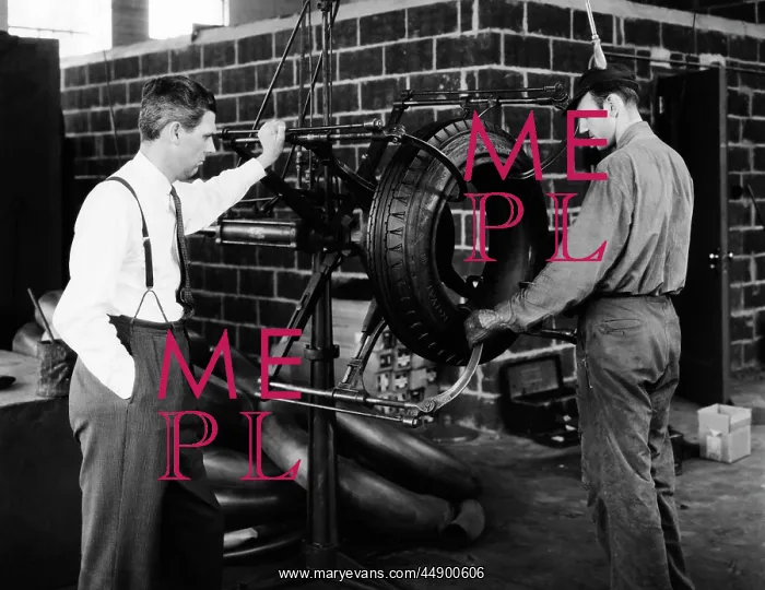 : 2 Men with Rubber Tire Machine Management Type Man in Suit : 2 Men with Rubber Tire Machine Management Type Man in Suit