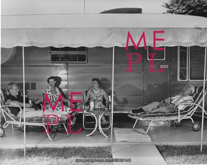 : 2 older couples sit under the awning of their mobile home : 2 older couples sit under the awning of their mobile home