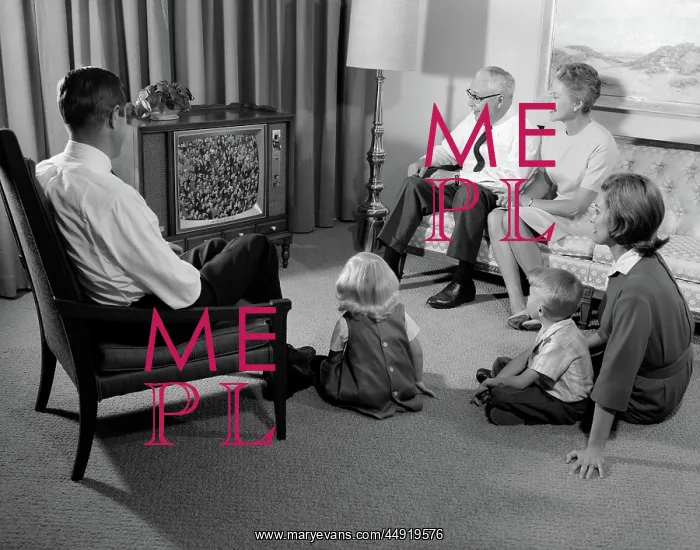  : 3 generation family watching television
