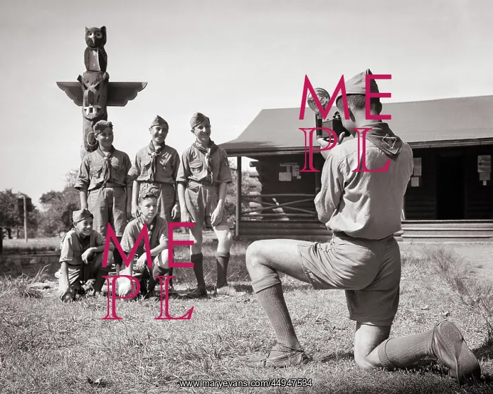 : 5 Boys at Camp Posing under Totem Pole Having : 5 Boys at Camp Posing under Totem Pole Having