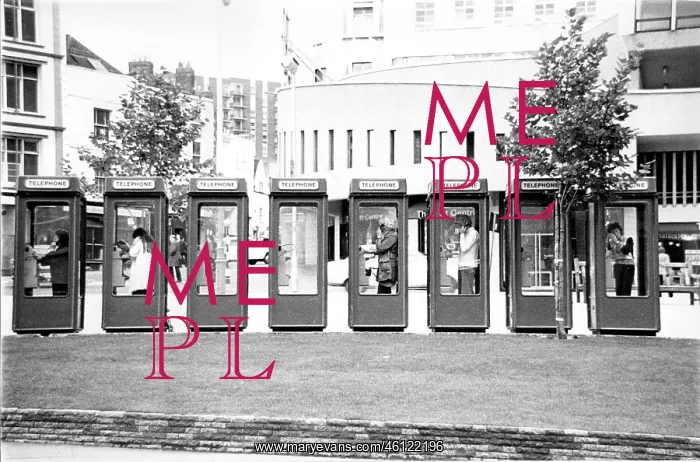 : 5 People on phone in a row of 8 telephone boxes : 5 People on phone in a row of 8 telephone boxes