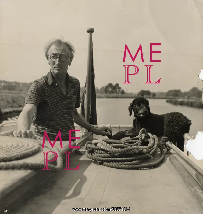 : A. P. Herbert steering a riverboat : A. P. Herbert steering a riverboat