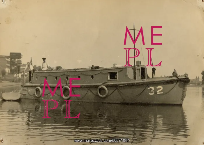 : A. P. Herbert steering a riverboat : A. P. Herbert steering a riverboat