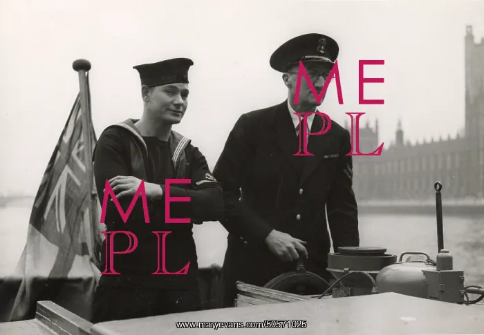 : A. P. Herbert steering a riverboat on the River Thames : A. P. Herbert steering a riverboat on the River Thames