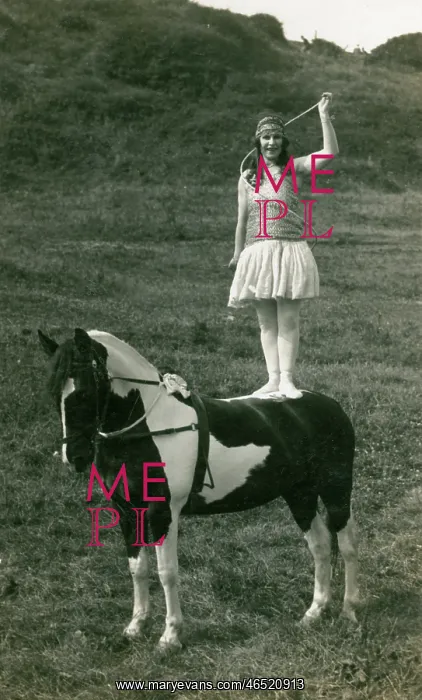 : Acrobat of Sangers Circus standing on a horse : Acrobat of Sangers Circus standing on a horse