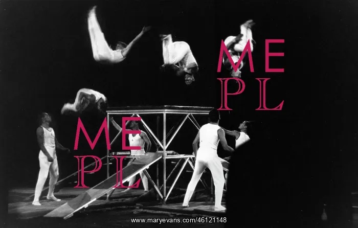 : Acrobats turn aerial summersaults : Acrobats turn aerial summersaults