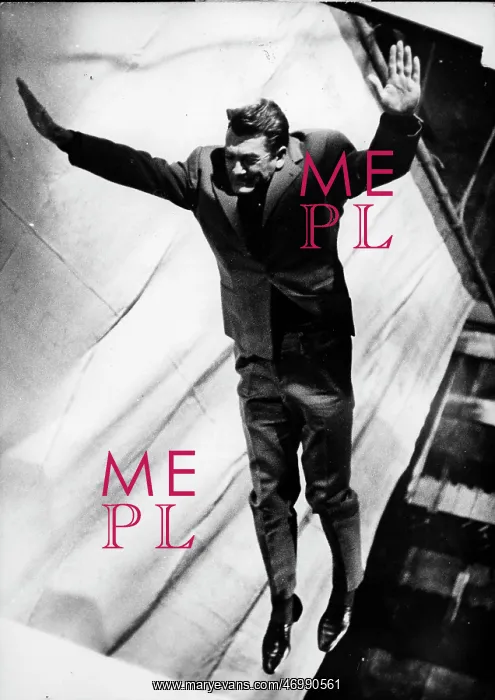  : Actor Jean Marais jumping in the air