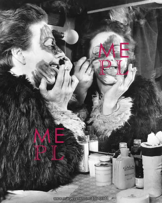 : Actress Freda Wyn doing cat makeup for a pantomime : Actress Freda Wyn doing cat makeup for a pantomime
