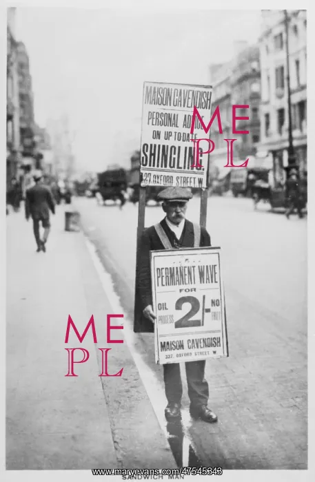 : An advertisement board man on the streets of London : An advertisement board man on the streets of London