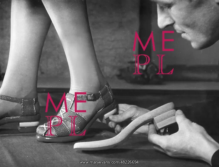 : Adjusting a pair of sandals at a shoe factoy in Berlin : Adjusting a pair of sandals at a shoe factoy in Berlin