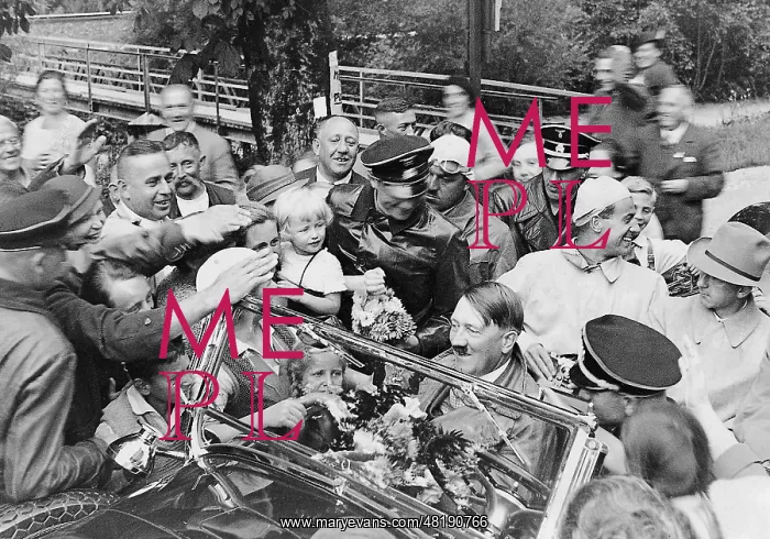 : Adolf Hitler in a car surrounded by people, 1934 : Adolf Hitler in a car surrounded by people, 1934