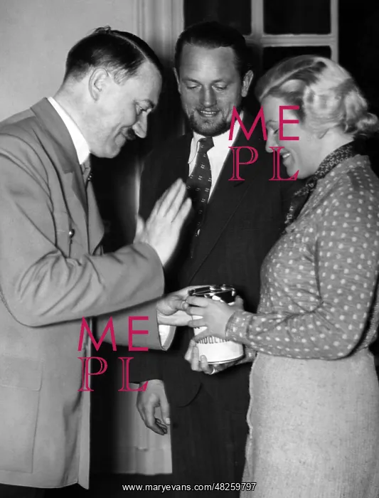 : Adolf Hitler contributes to donation box, 1934 : Adolf Hitler contributes to donation box, 1934