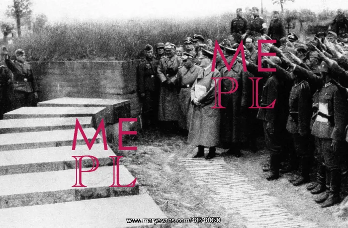 : Adolf Hitler with his followers at the cemetery : Adolf Hitler with his followers at the cemetery