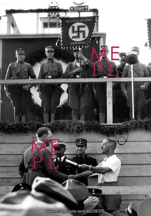 : Adolf Hitler is handed a baton, 1938 : Adolf Hitler is handed a baton, 1938