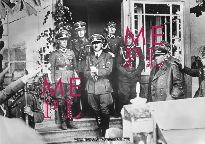 : Adolf Hitler leaving his overnight quarters at : Adolf Hitler leaving his overnight quarters at