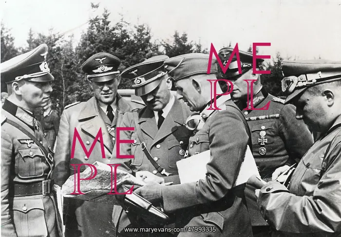 : Adolf Hitler, with officers, study maps during the : Adolf Hitler, with officers, study maps during the