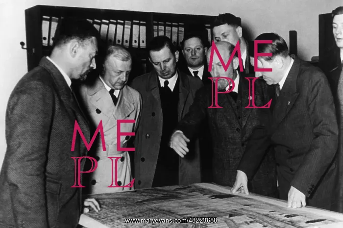 : Adolf Hitler with plans for a reconstruction of the Deu : Adolf Hitler with plans for a reconstruction of the Deu