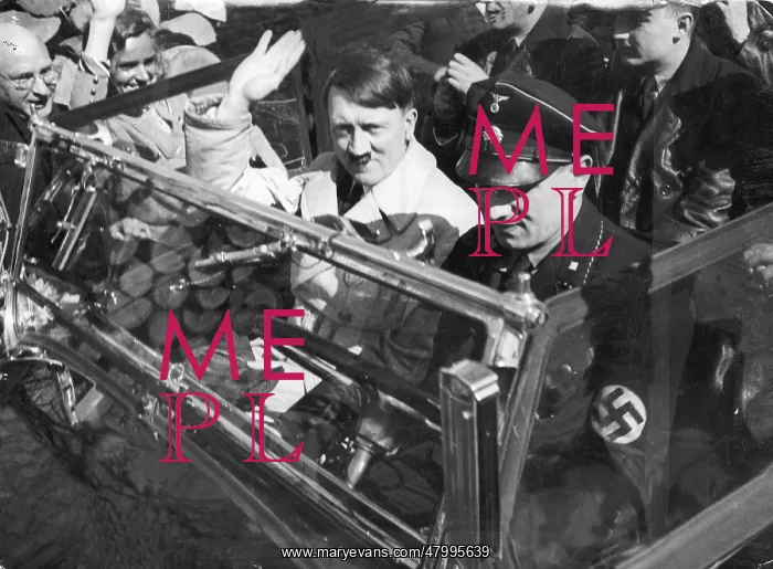 : Adolf Hitler saluting from a convertible car : Adolf Hitler saluting from a convertible car