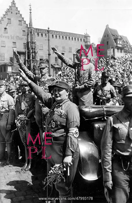 : Adolf Hitler (standing in the car ) greets parading : Adolf Hitler (standing in the car ) greets parading