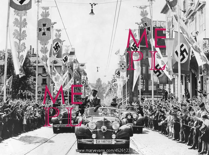 : Adolf Hitler waving to crowds from his car at : Adolf Hitler waving to crowds from his car at
