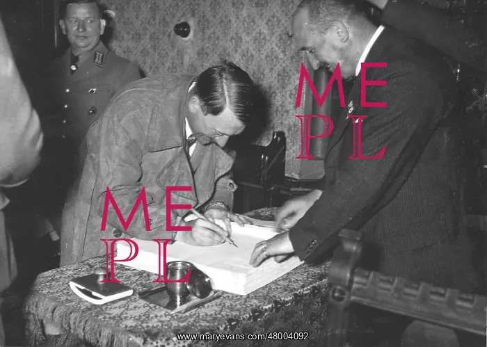  : Adolf Hitler writes in Golden Book of Munich after speech