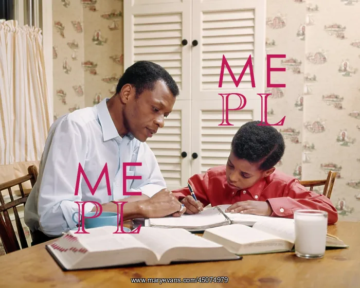 : African-American Father Helping Son with Homework at : African-American Father Helping Son with Homework at