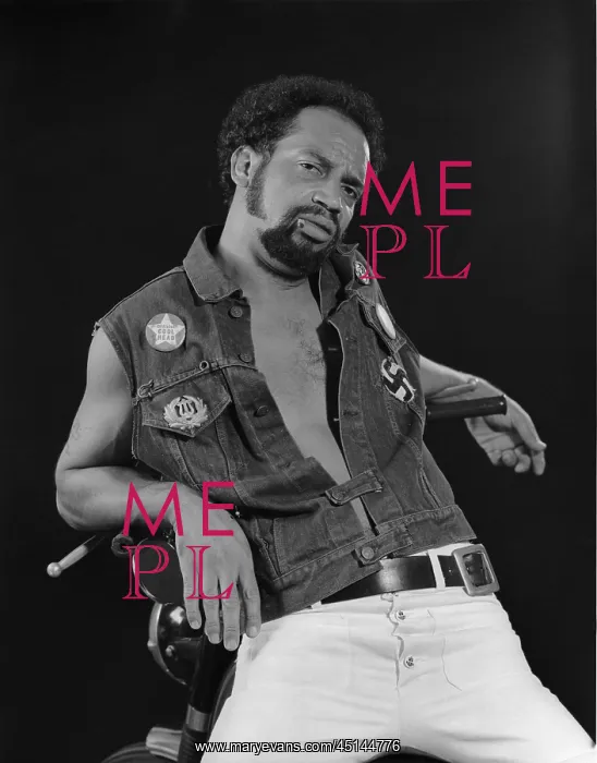 : African American man leaning on his motorcycle : African American man leaning on his motorcycle