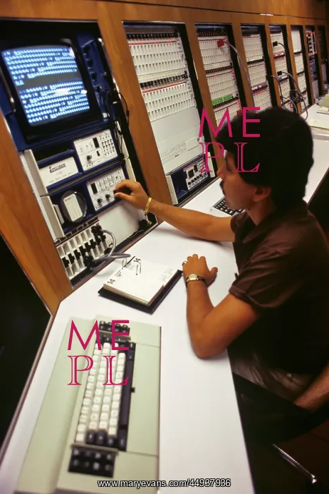  : African American Man Technician Working at Computer