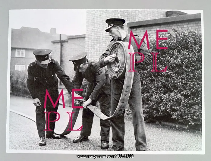 : AFS volunteers undergoing hose drill, WW2 : AFS volunteers undergoing hose drill, WW2