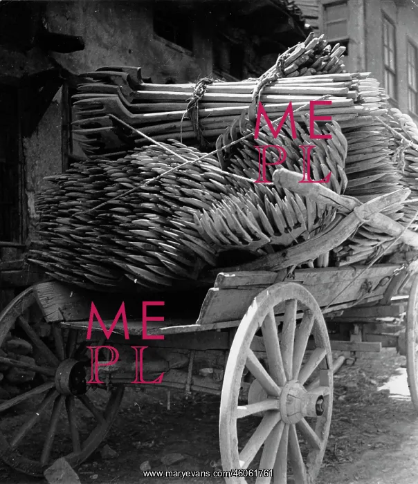 : Agricultural tools on a wooden cart : Agricultural tools on a wooden cart