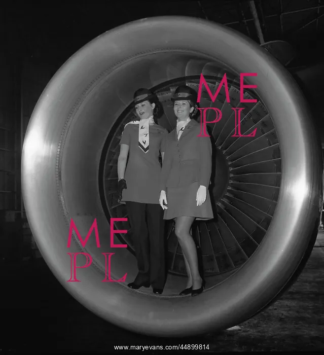 : Two air hostesses posing in a DC-10 engine : Two air hostesses posing in a DC-10 engine