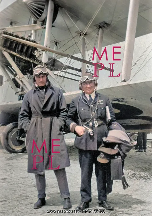 : Two airmen standing in front of plane : Two airmen standing in front of plane