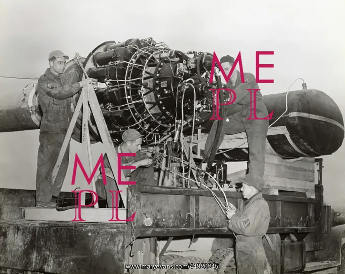 : Airmen Working on a Jet Engine Mounted on a Special Fram? : Airmen Working on a Jet Engine Mounted on a Special Fram?