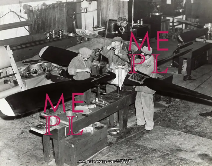 : Airmen Working on a Propeller at the Headquarters of the? : Airmen Working on a Propeller at the Headquarters of the?