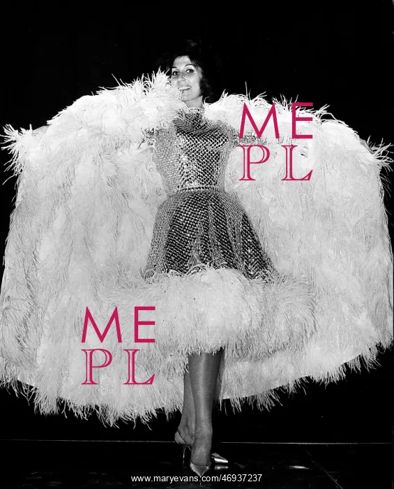 : Alma Cogan, singer, in feathery costume : Alma Cogan, singer, in feathery costume