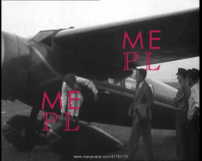 : Amelia Earhart Exiting Her Plane : Amelia Earhart Exiting Her Plane