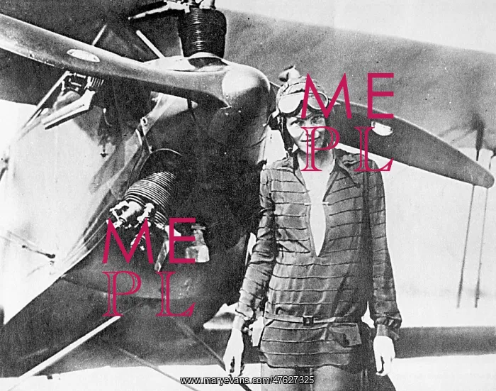 : Amelia Earhart, pioneering aviator, with plane : Amelia Earhart, pioneering aviator, with plane