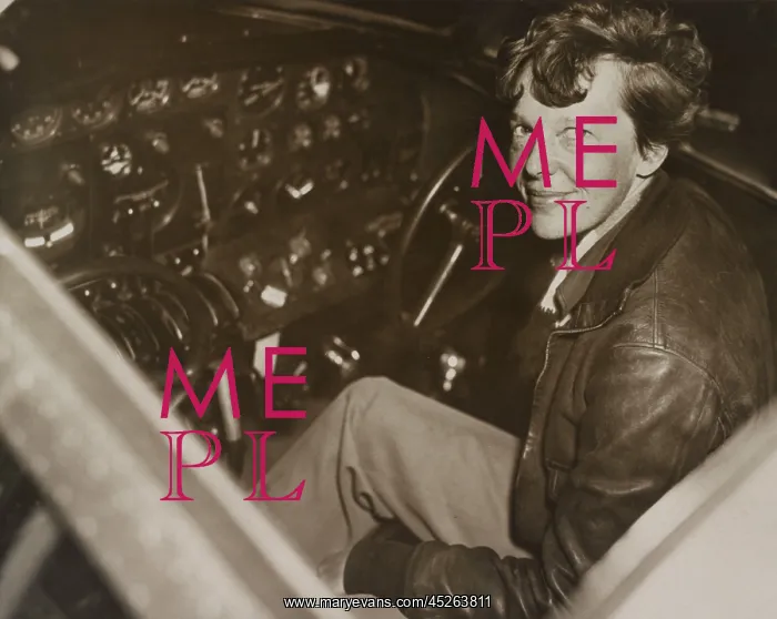 : Amelia Earhart sitting in the cockpit of her Lockheed : Amelia Earhart sitting in the cockpit of her Lockheed