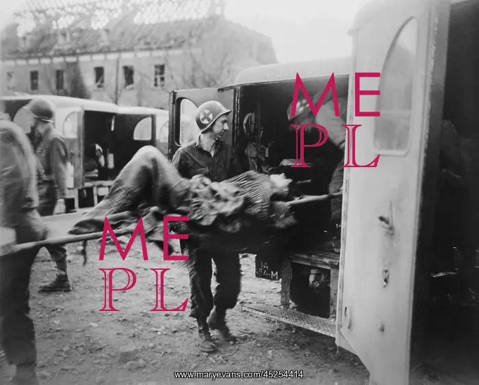 : American medics place an almost-dead German slave : American medics place an almost-dead German slave