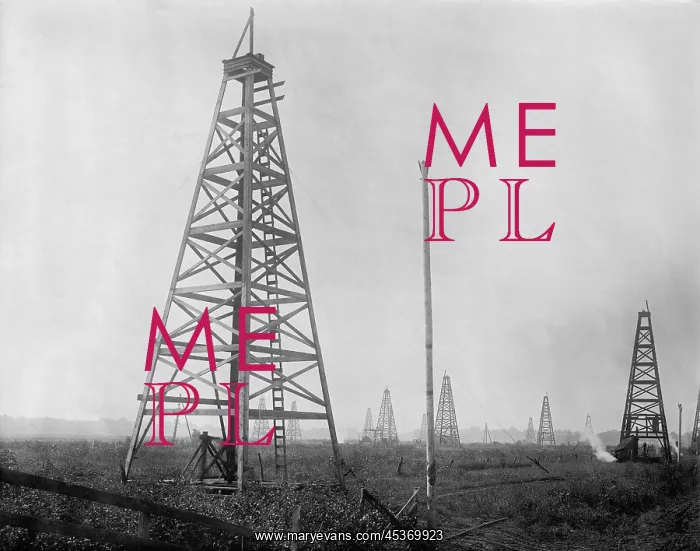 : An American oil field with several derricks : An American oil field with several derricks