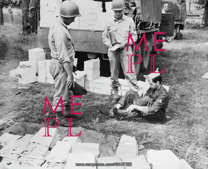 : American soldier being fitted for a par of : American soldier being fitted for a par of
