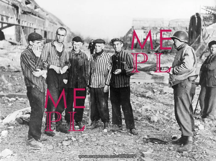 : American soldier with prisoners in the concentration camp in : American soldier with prisoners in the concentration camp in