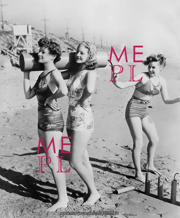 : American women on a beach with a large firework : American women on a beach with a large firework