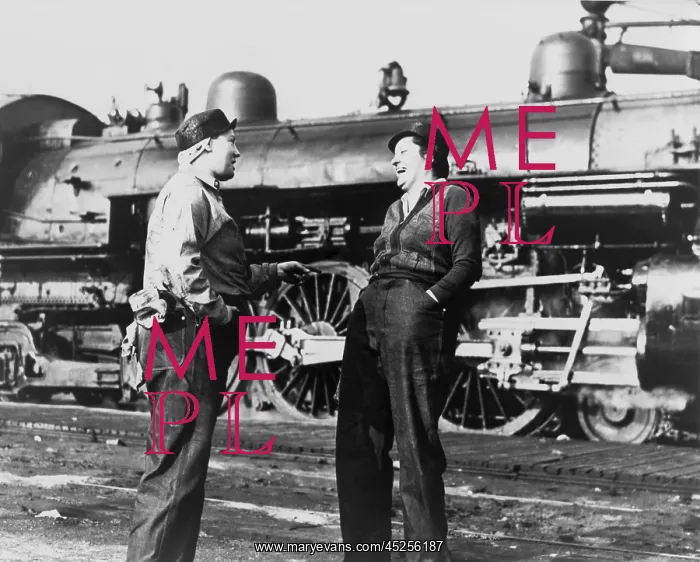 : Two American women railroad workers talk after : Two American women railroad workers talk after
