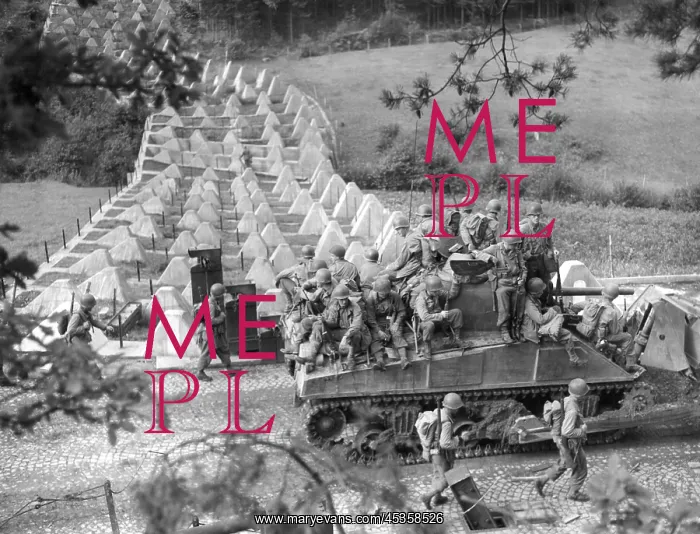 : Americans roll through Siegfried Line on a tank : Americans roll through Siegfried Line on a tank