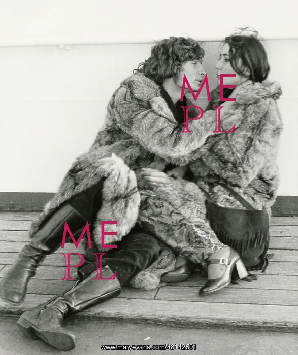 : Amorous young couple in fur coats : Amorous young couple in fur coats