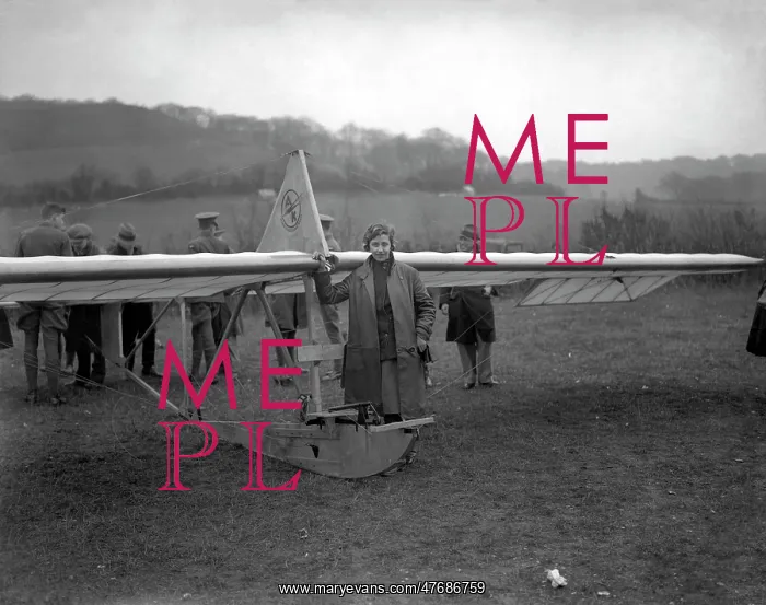 : Amy Johnson alongside a Zogling primary glider : Amy Johnson alongside a Zogling primary glider