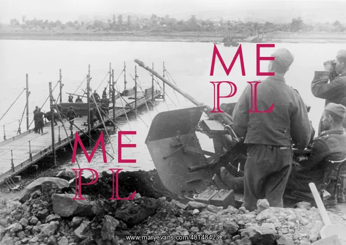 : Anti-aircraft gun secures the construction of a bridge over : Anti-aircraft gun secures the construction of a bridge over