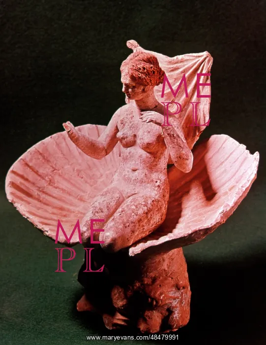 : Aphrodite kneeling in a Shell - terracotta statuette : Aphrodite kneeling in a Shell - terracotta statuette